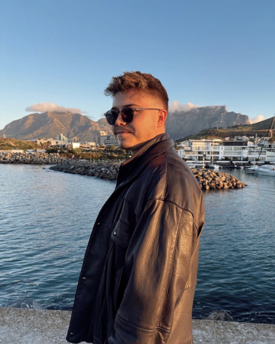 Brendan Pottie, Cape Town wedding and portrait photographer, at the V&A Waterfront with Table Mountain behind him