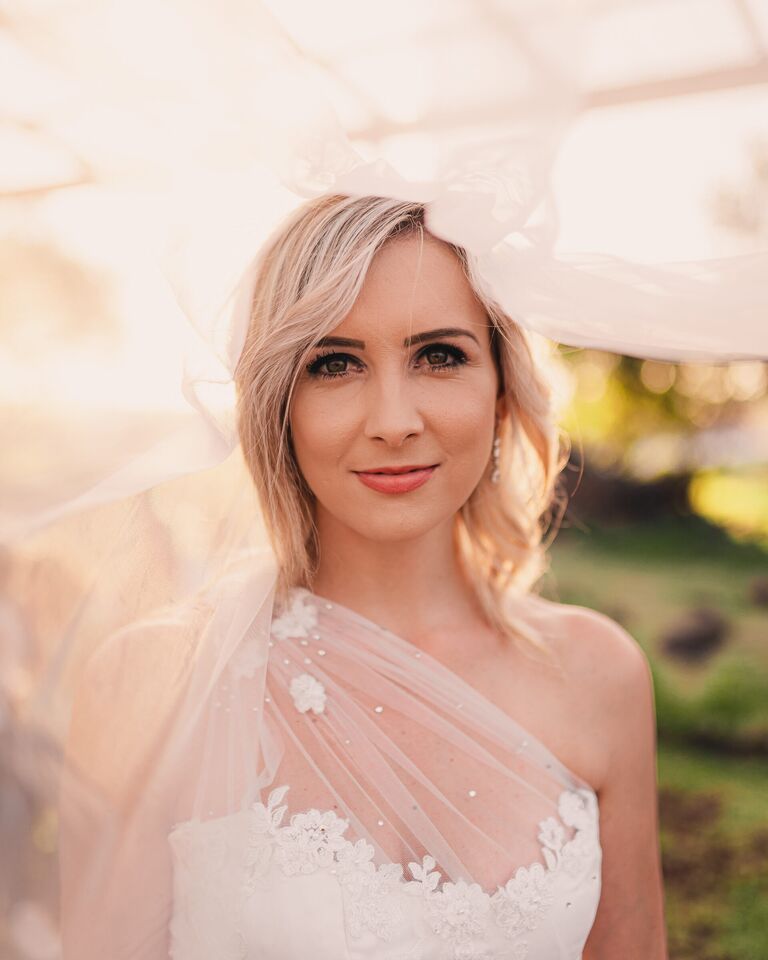 Bridal portrait beneath a veil