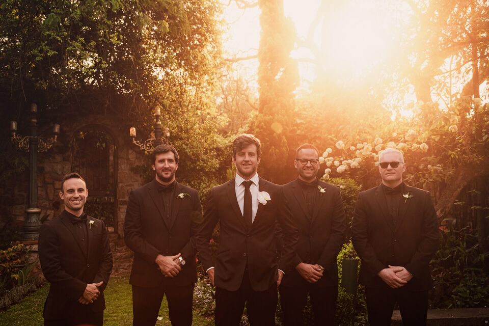 Groomsmen photographed at golden hour